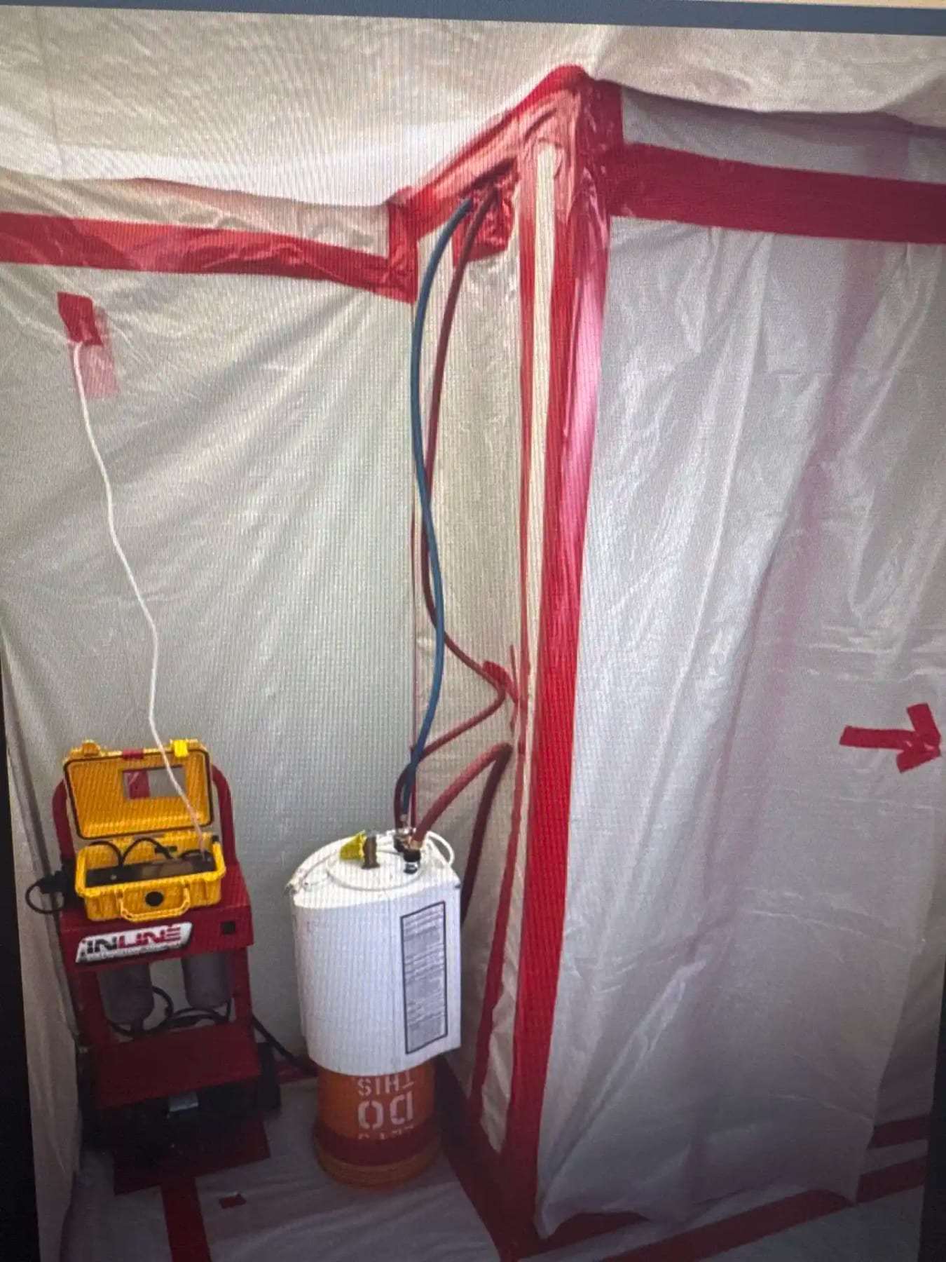 Zippered plastic containment with a decontamination unit and supplies outside it